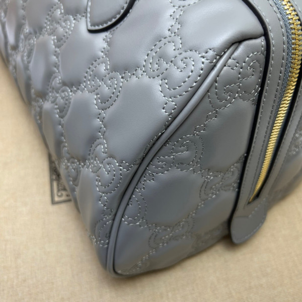 G*u*i gg matelassé leather top handle bag