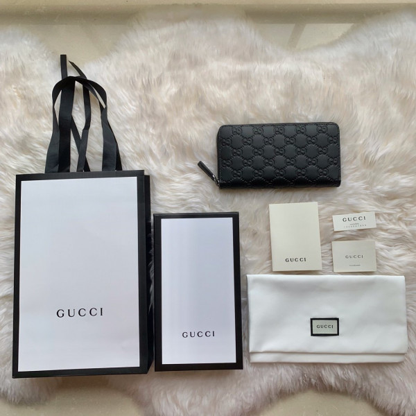 G*u*i leather zip around wallet
