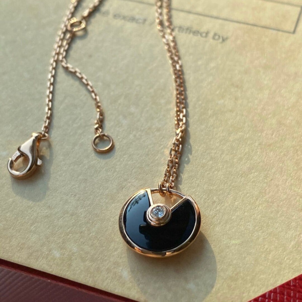 Ca*t*er  amulet necklace