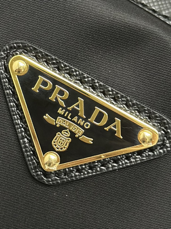 Pra*a re-nylon and saffiano leather top-handle bag