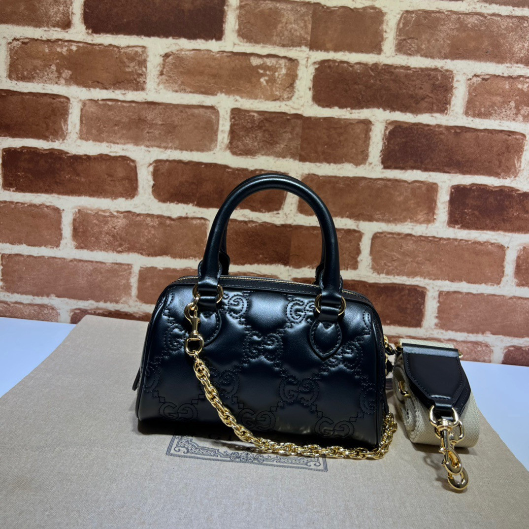 G*u*i gg matelassé leather top handle bag